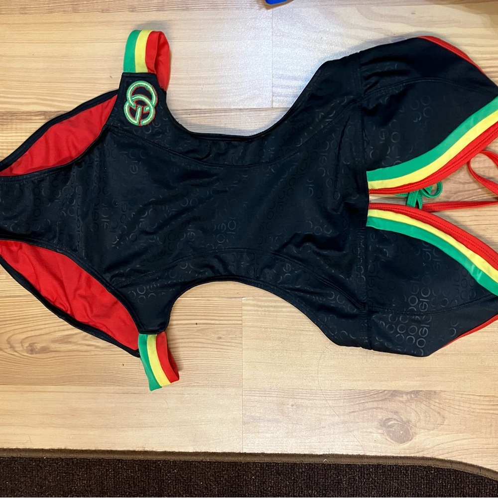 COOGI Black One Piece with Red, Yellow, and Green Accents